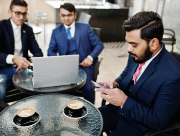Client checking the registration papers of a private investigator in Delhi